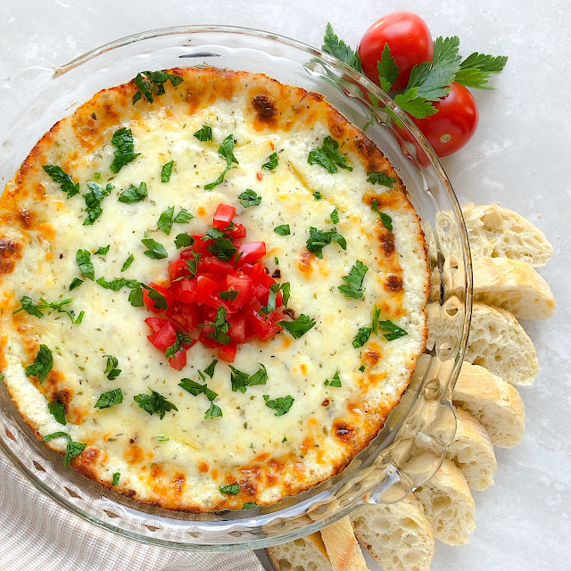 melted cheese with tomatoes and bread