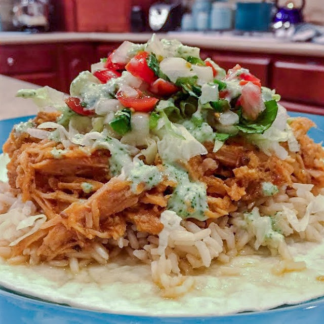 shredded pork on tortillas with rice, salad and dressing