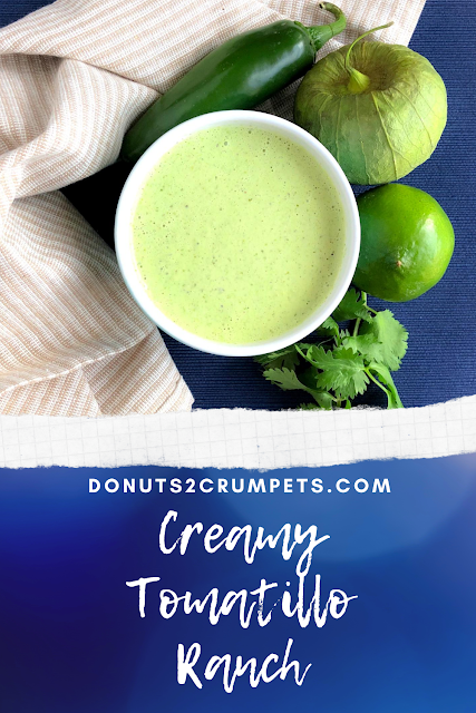 green dressing in a white bowl with tomatillo, jalapeno, lime and cilantro