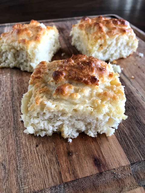 baked biscuits on a wooden cutting board