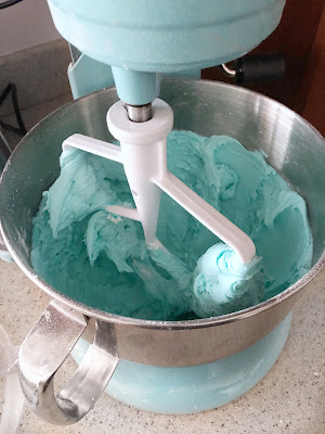 aqua frosting in an aqua kitchen aid mixer