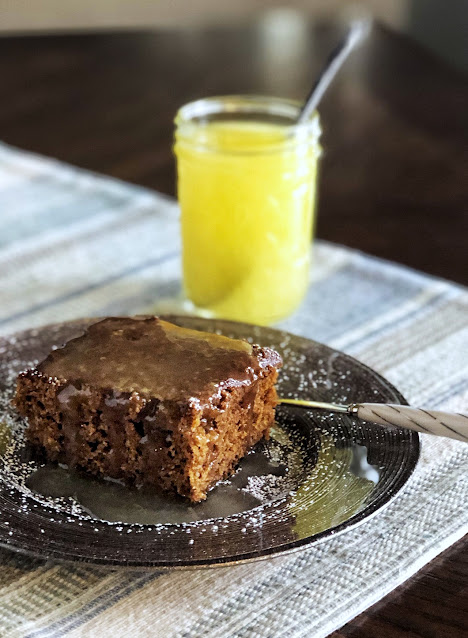 gingerbread cake with lemon sauce on a brown plate