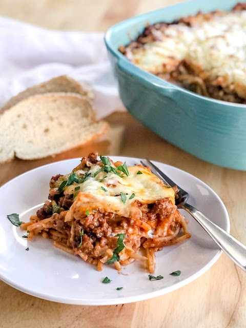 baked spaghetti casserole garnished with chives