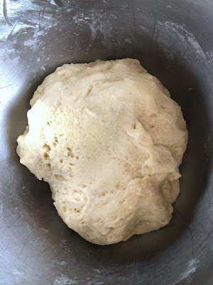 kneaded waffle dough in a stainless steel bowl
