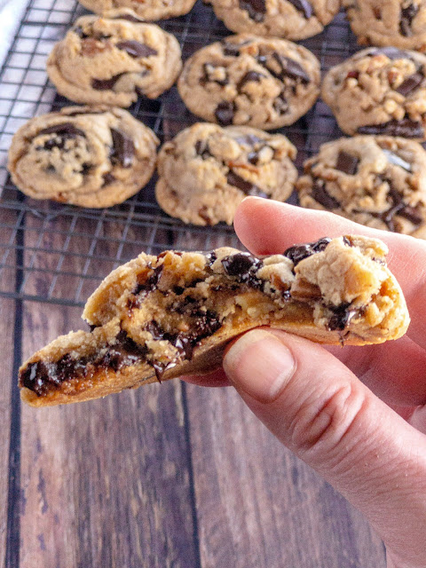 cookies on a cooling rack with a gooey cookie