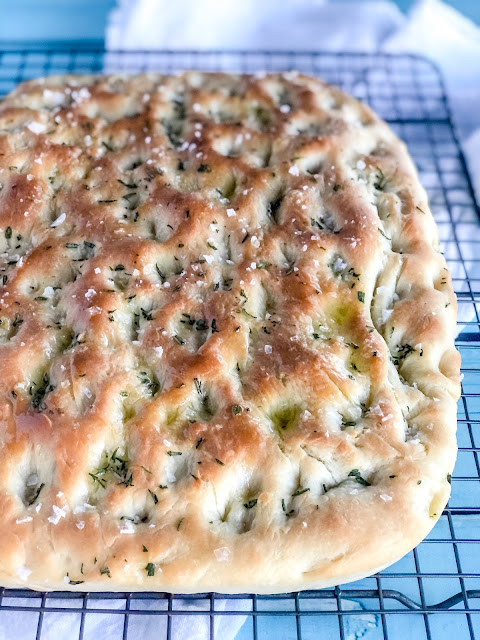 herby focaccia on a cooling rack