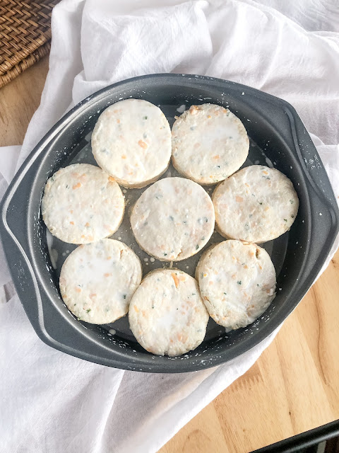 unbaked biscuits in a baking pan