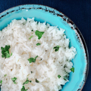rice in a blue bowl with cilantro