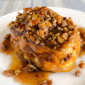 french toast covered in syrup and pecans