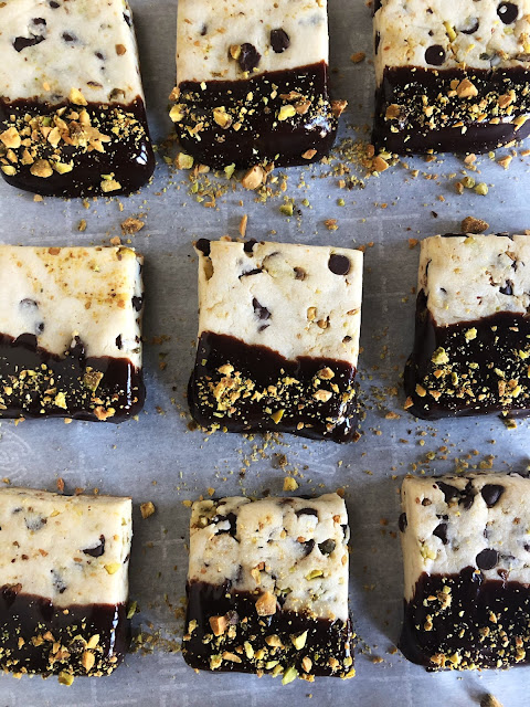 chocolate and pistachio shortbread dipped in chocolate and sprinkled with pistachios