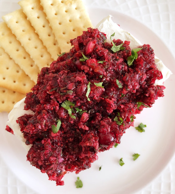 cranberry salsa over cream cheese with crackers