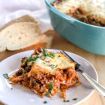 baked spaghetti casserole garnished with chives