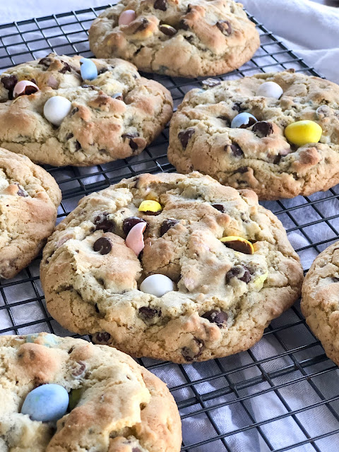 cookies with mini eggs on a cooling rack