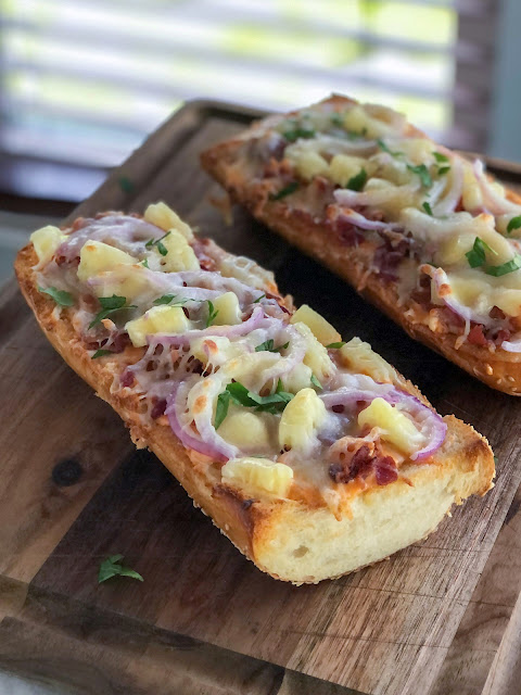 french bread toasted with pineapple bacon and red onion