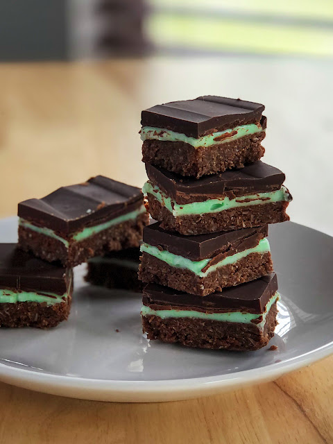 chocolate no bake peppermint slice bars on a white plate