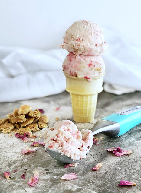 ice cream cone with a scoop of ice cream and graham crackers