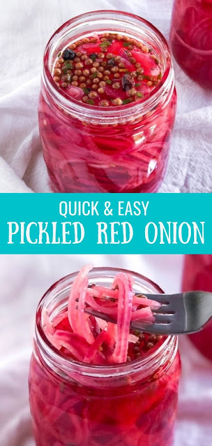 pickled red onions in a jar with pink vinegar and spices