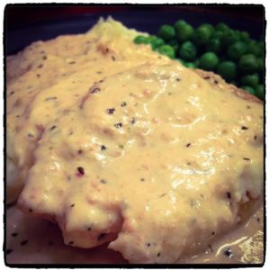 chicken and sauce with peas