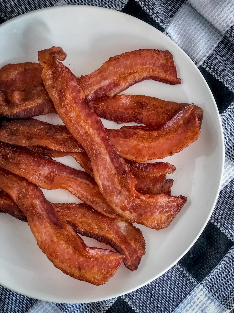 baked bacon on a white plate