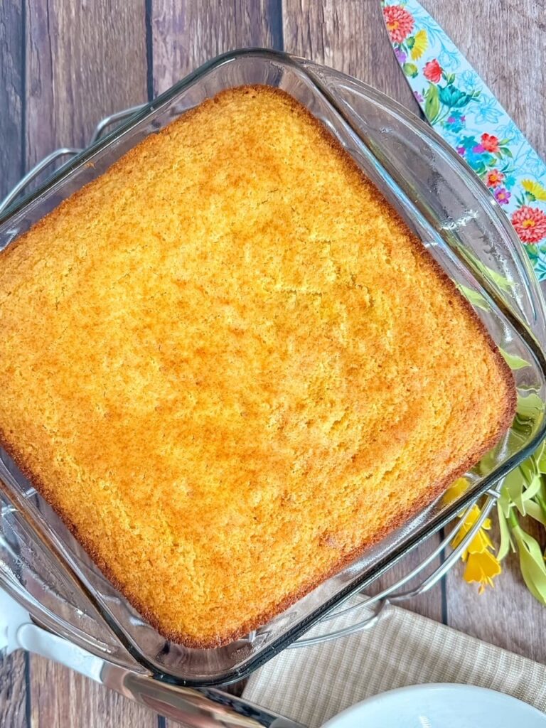 glass pan of cornbread with knife