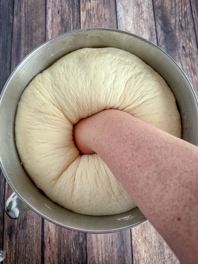 punched down dough in a bowl