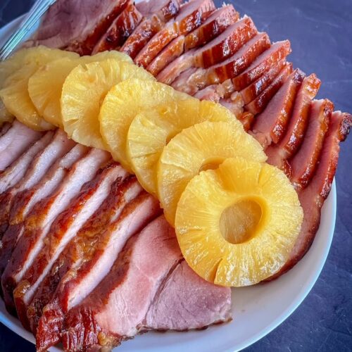 sliced baked holiday ham with pineapple