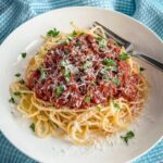 spaghetti with sauce and cheese