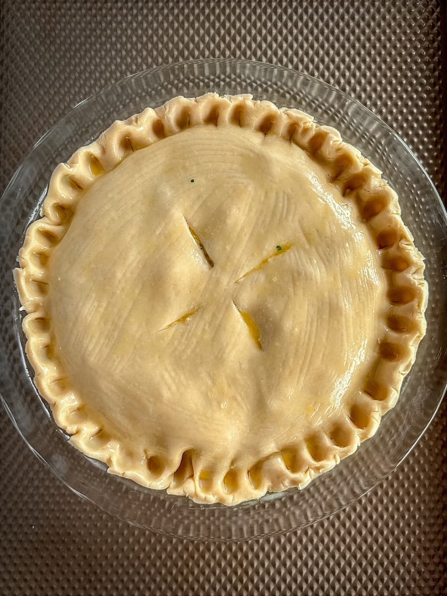 unbaked chicken pot pie with slits on top
