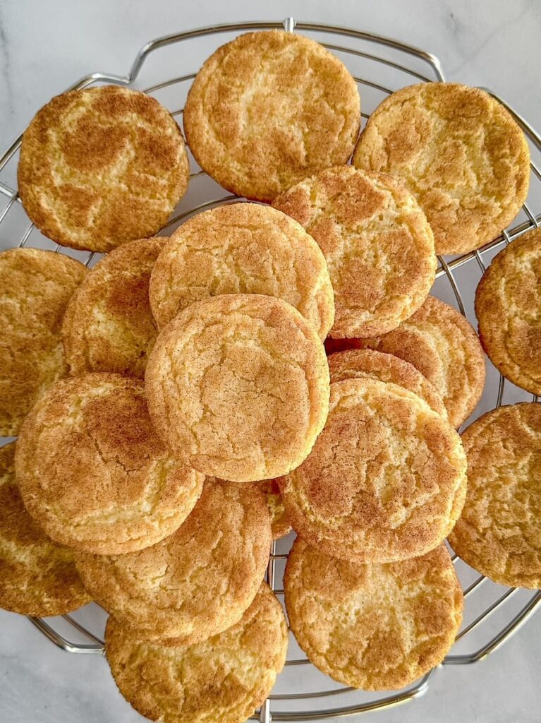 snickerdoodle cookies on a cooling rack