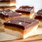 millionaire shortbread bars on a wooden board