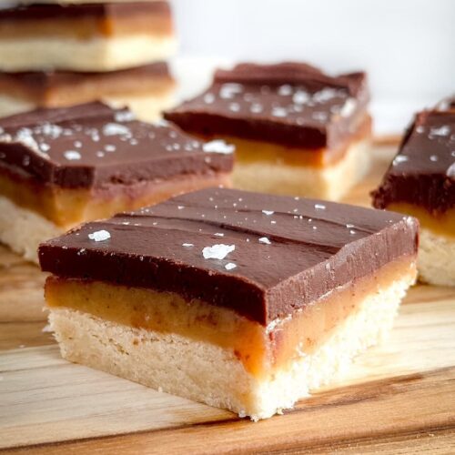 millionaire shortbread bars on a wooden board