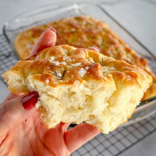 slice of fluffy focaccia bread with rosemary and sea salt