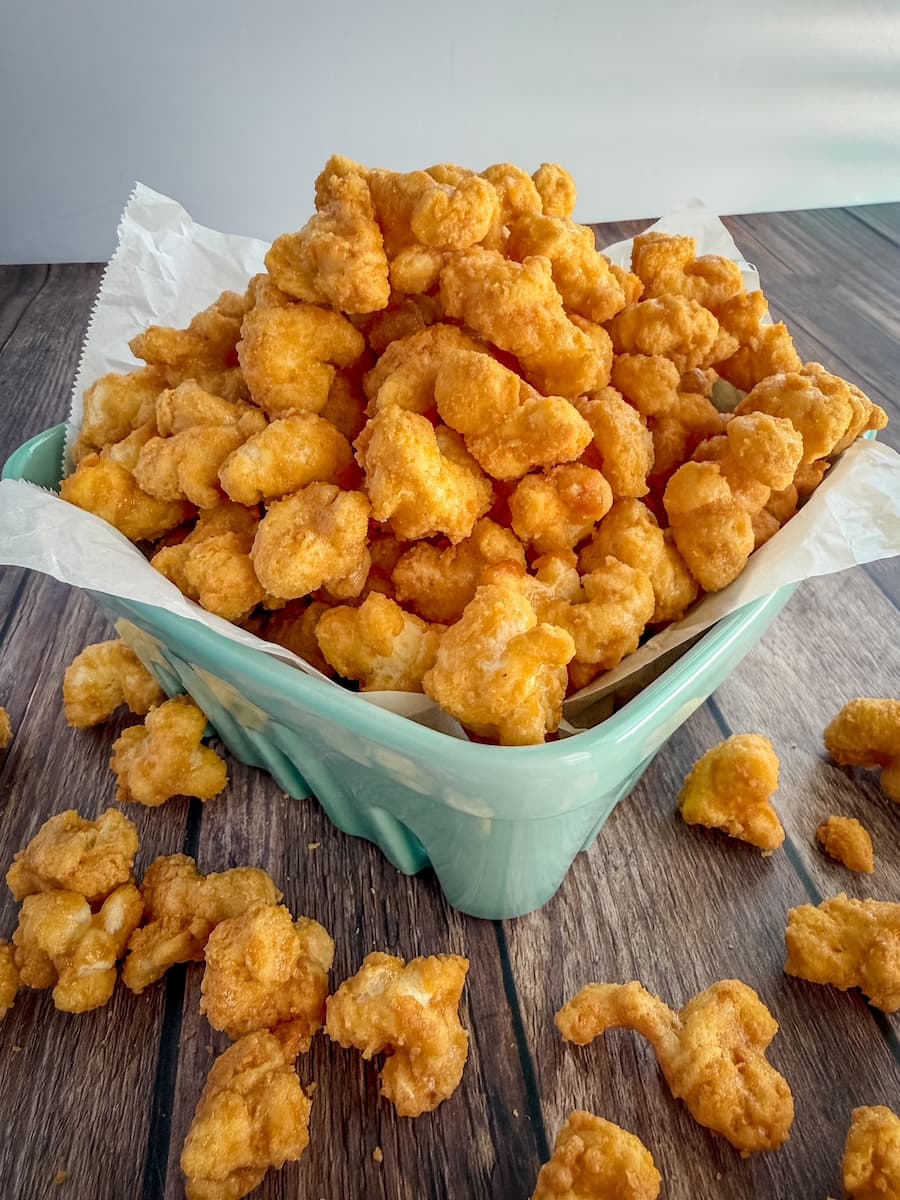 A bowl filled with buttery homemade caramel puff corn.